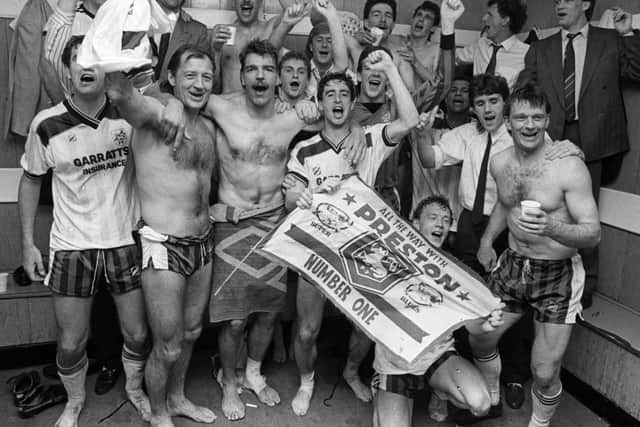The Preston North End squad celebrate promotion at Orient in April 1987 - John Thomas is on thr front row holding the flag