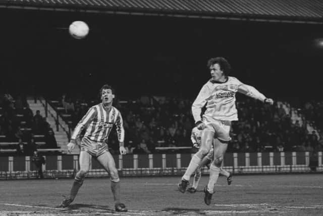 John Thomas heads the ball in PNE's visit to Stockport in February 1986