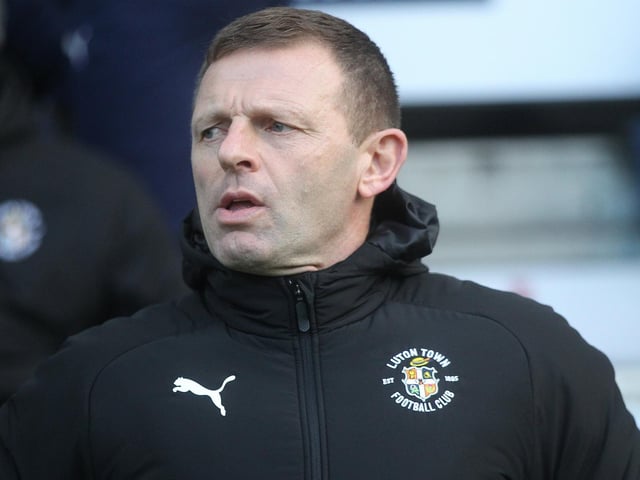 Luton Town boss Graeme Jones looks on at Deepdale.