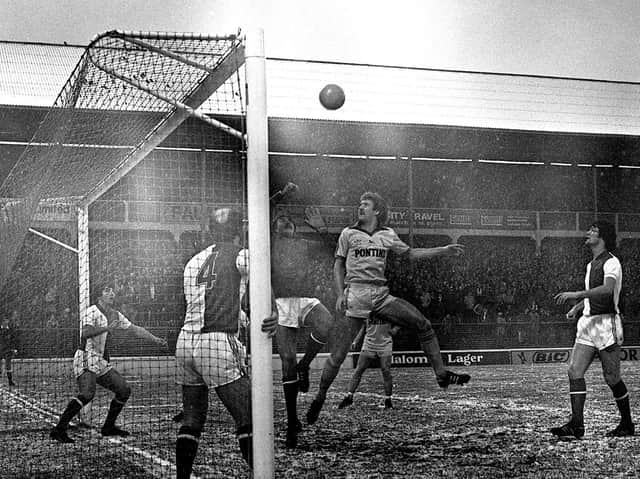 Preston centre-half Mick Baxter challenges Blackburn keeper John Butcher at Ewood Park on Boxing Day 1980, with Howard Kendall covering the post for the home side