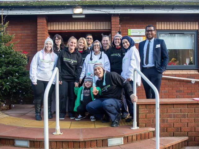 Staff at Riverdale Insurance, in Preston, gave hoodies and jumpers to Derian House children's hospice in Chorley
