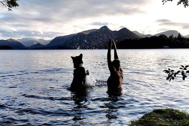 Charlie Jackson making a splash for her pet dog
