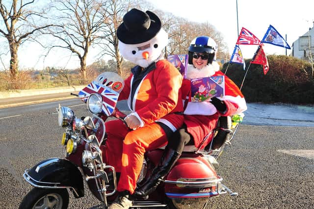 Tracey Crowther and Tony Welsby who are dressed in Mrs Santa and snowman outfits respectively