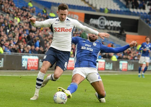 Preston midfielder Alan Browne is tackled by Cardiff's Jazz Richards