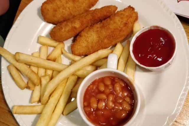 The chicken goujons, fries, and baked beans from the children's menu