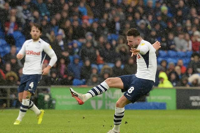 Alan Browne has a shot at goal against Cardiff, watched by Preston team-mate Ben Pearson