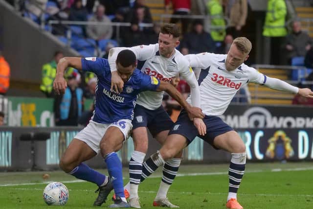 Preston's Alan Browne and Tom Clarke battle with Cardiff's Curtis Nelson
