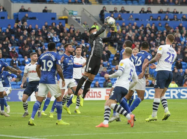 Cardiff keeper Neil Etheridge gathers a corner as PNE players Tom Clarke, Patrick Bauer, Sean Maguire and Andrew Hughes look on