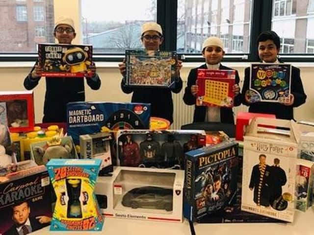 Eden Boys with some of the toys they bought