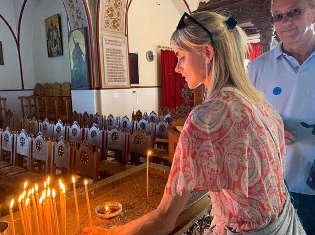 Sophie visits a church on her travels