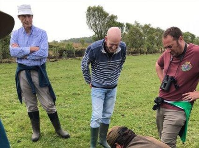Mike Longden ( far right) watching peat core extraction at Winmarleigh Moss