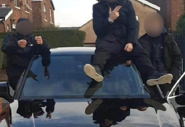 Daft yobs in burglary gang posted picture of themselves posing with this stolen car on Facebook
