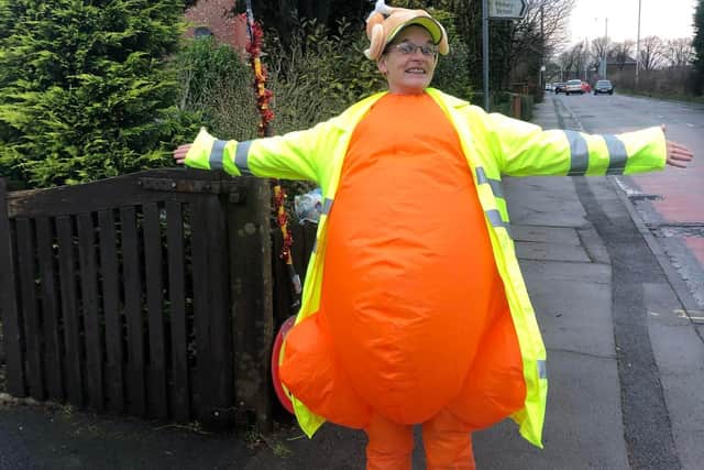 Lollipop lady Nina Mallinson, 39, has been getting into the Christmas spirit by dressing up for her crossing patrols at Freckleton Strike Lane Primary School