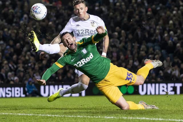 PNE striker David Nugent challenges with Leeds defender Ben White