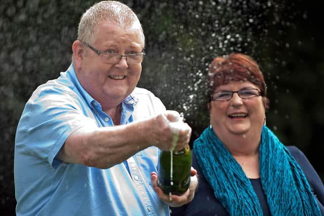 Colin Weir and his wife Chris pose for pictures during a photocall in Falkirk, Scotland, on July 15, 2011 (Wattie Cheung/AFP via Getty Images)