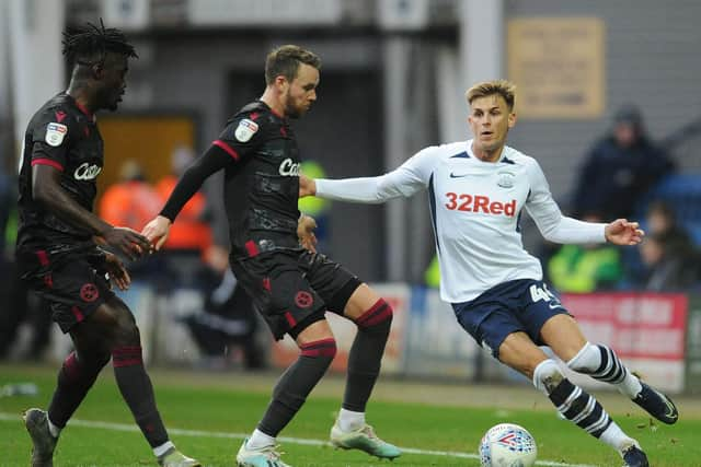 Preston midfielder Brad Potts takes on Reading's Chris Gunter