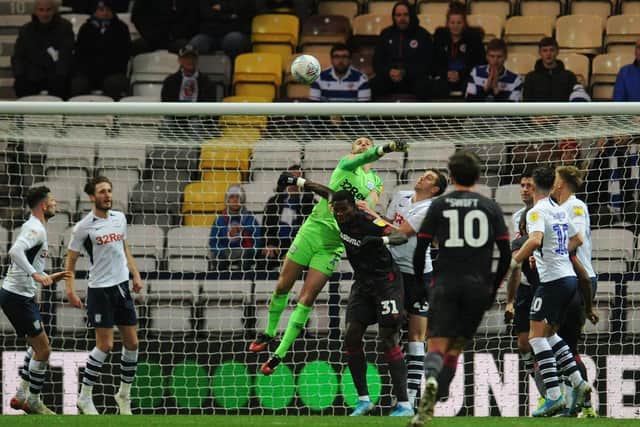 Preston goalkeeper Declan Rudd punches clear against Reading