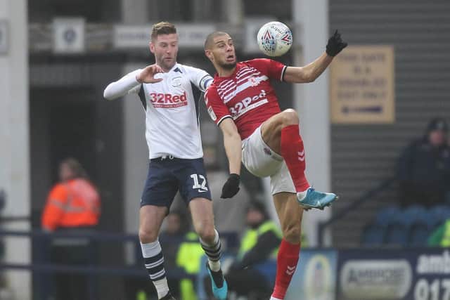 Paul Gallagher and Rudy Gestede battle for the ball at Deepdale