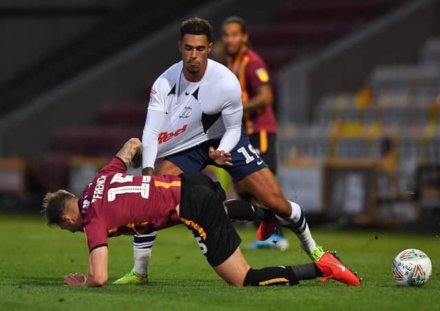 Andre Green battles with Bradford City's Tyler French in the League Cup earlier this season