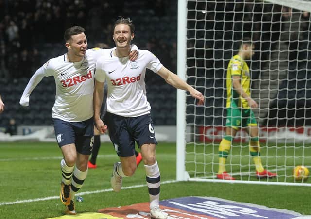 Ben Davies (right) celebrates scoring against Norwich last season