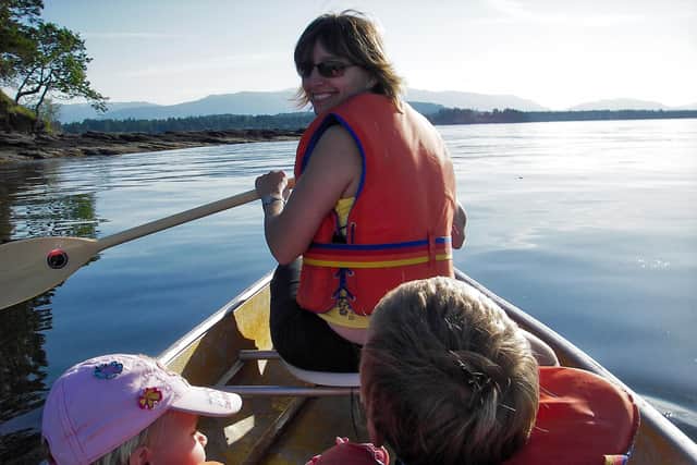 Liz Deacle in a canoe with her children when they were younger