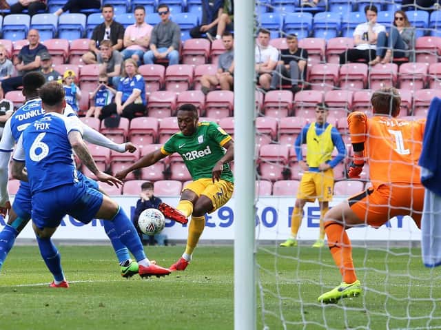 Preston's Darnell Fisher has a shot in last season's visit to Wigan Athletic