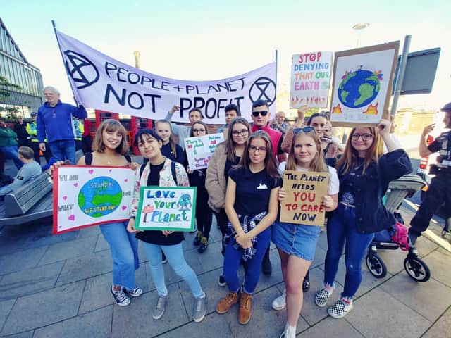Climate change activists outside Preston Railway Station in 2019
