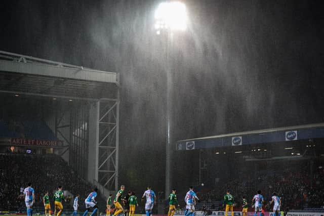 The rain shows up in the Ewood Park floodlights during Preston's 1-1 draw with Blackburn