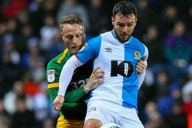 PNE skipper Tom Clarke grapples with Adam Armstrong