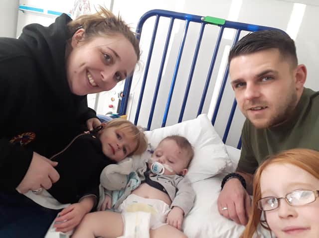 Zach and Danielle Jones with children (from left) Nova, aged two, Blake, 18 months, and Morgan, eight