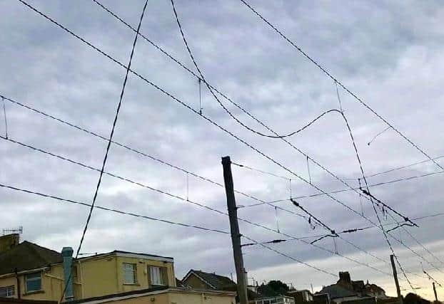 Work has continued through the night to repair the 25,000-volt overhead cables. Pic: Network Rail