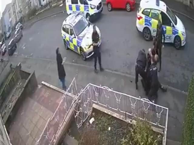 CCTV footage appears to show a police officer punching a 34-year-old man who was being detained in Accrington.