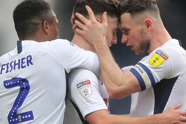 Josh Harrop (centre) is congratulated by Darnell Fisher and Alan Browne after scoring Preston's first goal in their victory over Charlton