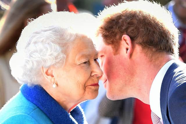 Queen Elizabeth II being greeted by her grandson the Duke of Sussex