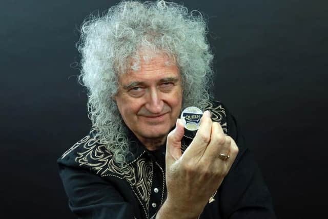 Royal Mint of Queen guitarist Brian May with the Queen 2020 UK 5 brilliant uncirculated coin