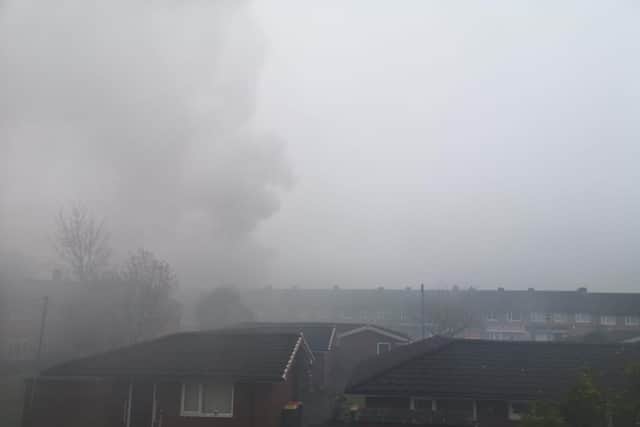 Fire crews are dealing with a fire at three derelict flats in Starrgate Drive, Ashton