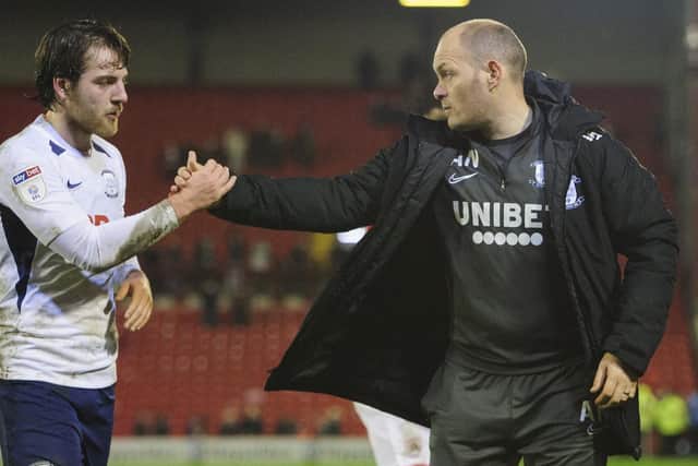 Alex Neil congratulates Ben Pearson after the win at Oakwell.