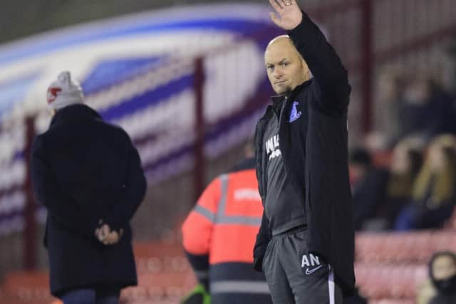 Alex Neil waves to the Preston supporters during the win at Barnsley