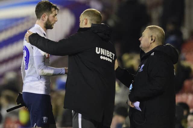 Two-goal Tom Barkhuizen gets a pat on the back from PNE manager Alex Neil when he is substituted at Barnsley
