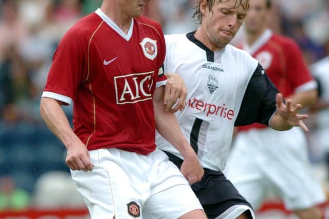 Preston midfielder Paul McKenna shadows Manchester United skipper Ole Gunnar Solskjaer at Deepdale in July 2006