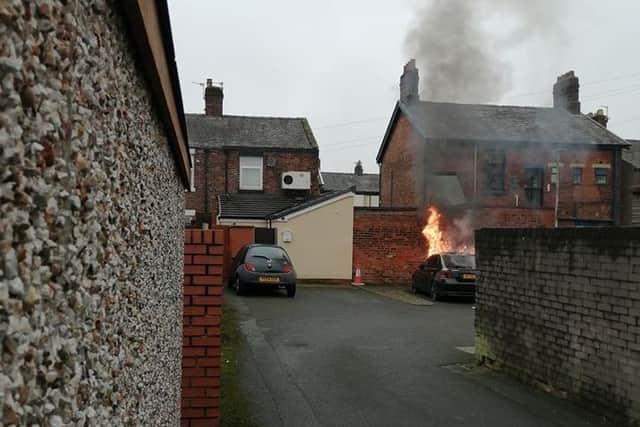 CCTV footage appears to show the Ford Mondeo being set on fire deliberately in an alley behind Grove Street in Bamber Bridge yesterday (Thursday, January 23). Credit: Matthew James Farrow