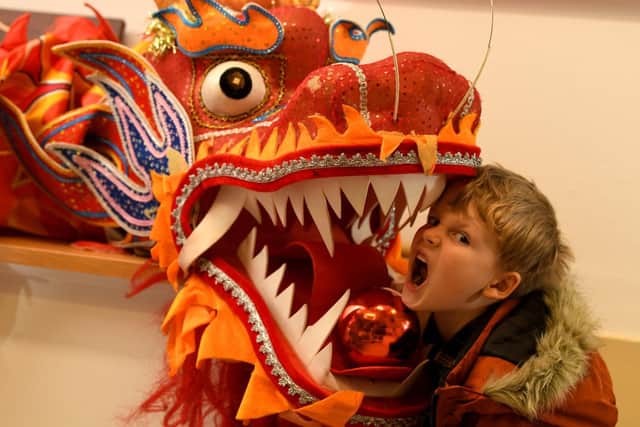 Diego Canavan, five, has a close encounter during the Chinese New Year celebrations