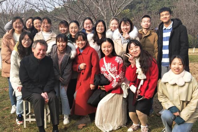 Prof Peter Hughes, 60, who teaches civil engineering and English at Henan Polytechnic University, with some of his students (Picture courtesy of Professor Peter Hughes)