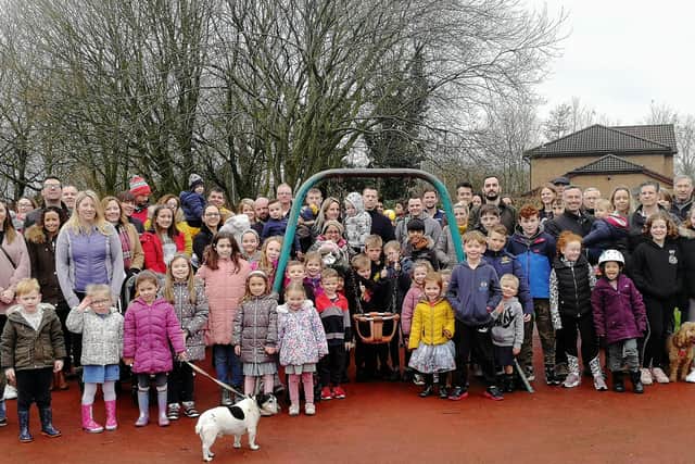 The fun stops here - families gather around Walton Park playground's last piece of equipment