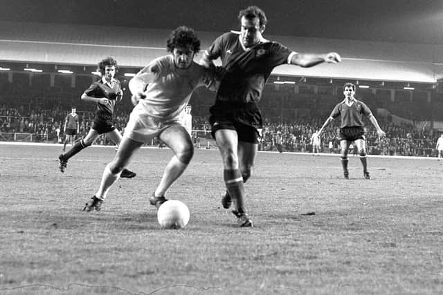 PNE midfielder Jimmy Brown holds off a challenge from a Crewe player at Anfield