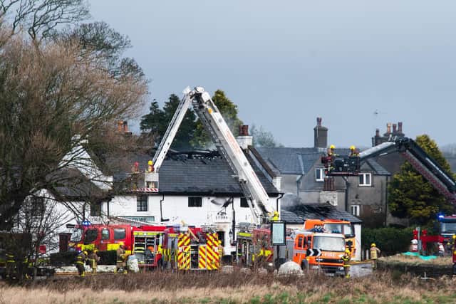 Firefighters tackle the blaze at The Stork Inn at Conder Green