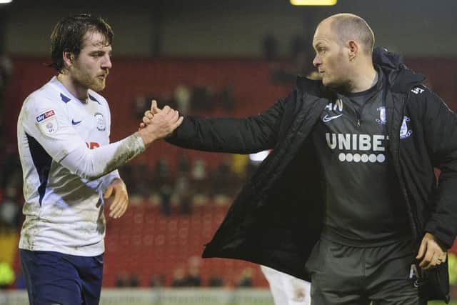 Preston manager Alex Neil shakes hands with Ben Pearson after the win at Barnsley