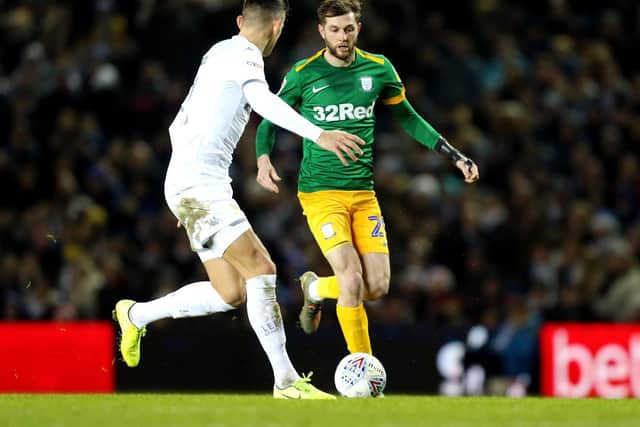 Preston's Tom Barkhuizen takes on a Leeds defender at Elland Road on Boxing Day