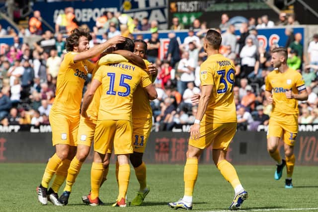 Joe Rafferty is mobbed by team-mates after opening the scoring in PNE's game against Swansea in August