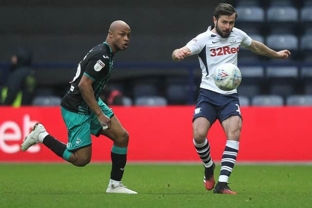 Preston left-back Joe Rafferty clears the ball against Swansea